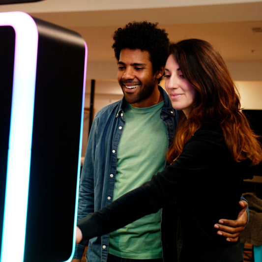 Couple Enjoying Photo Booth Rental in Rochester, NY