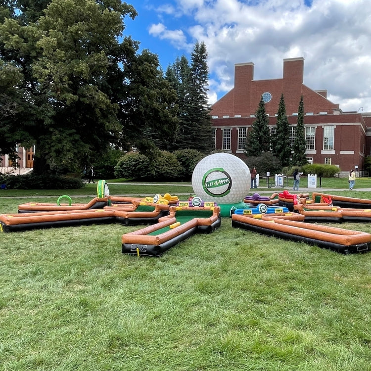 Portable mini golf course rental attraction set up for an event on a college campus quad in Rochester, NY.
