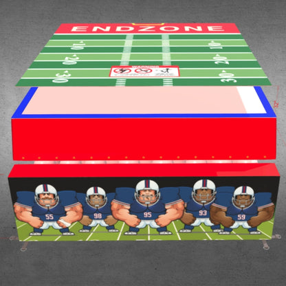 Downward view of the football-themed inflatable showing the field, end zone, and defensive player illustration.  
