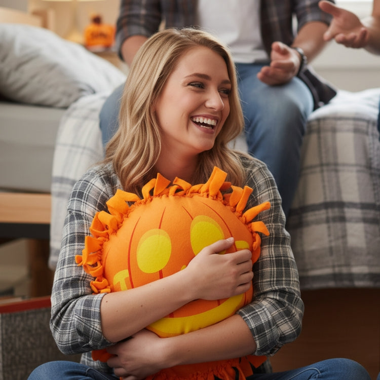 College Student Holding DIY Plush Pumpkin Pillow