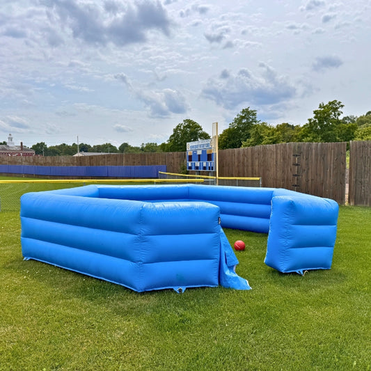 Inflatable Gaga Pit Game setup outdoors on a grassy field before an event begins in Rochester, NY.