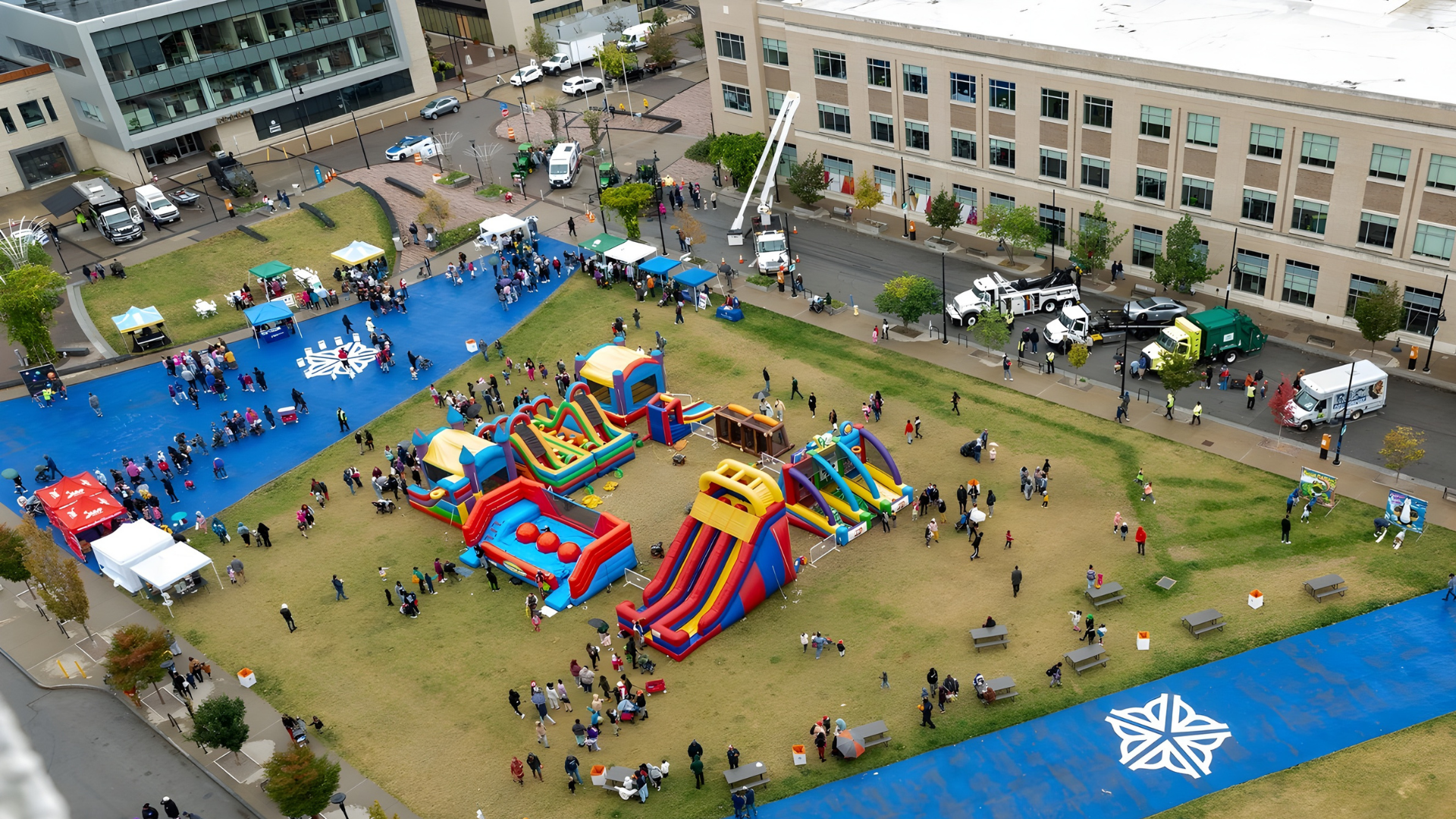 Overhead view of bounce houses and inflatables at a large-scale event in Rochester, NY.