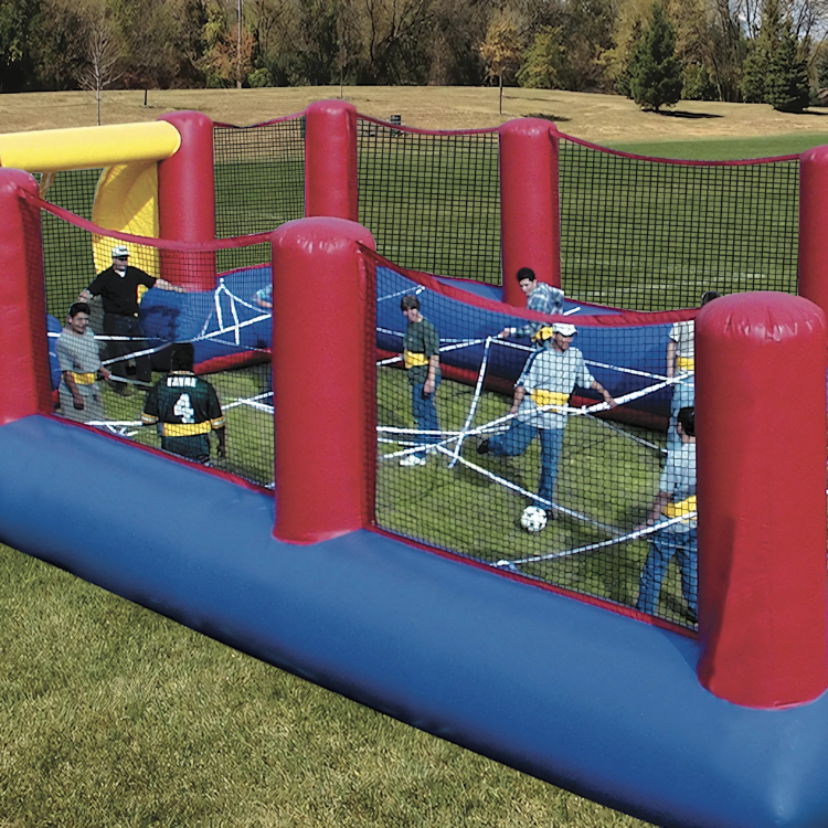 Players using the Human Foosball Soccer Themed Inflatable Attraction In Rochester, NY