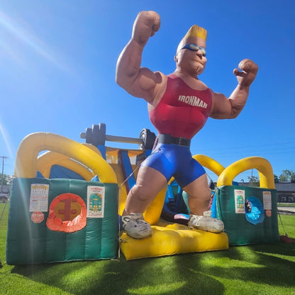 Large Inflatable Obstacle Course rental at outdoor event on sunny day with blue skies.