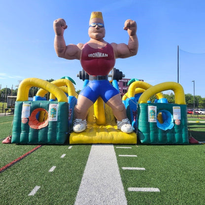 Inflatable Obstacle Course setup on turf sports field for an event in Rochester, NY.