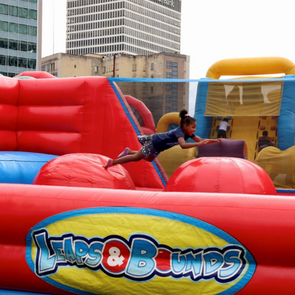 Girl Jumping on the Inflatable Leaps & Bounds Game Rental in Rochester, NY