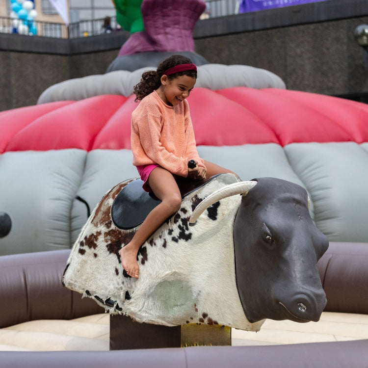 Girl Riding Mechanical Bull Rental in Rochester, NY at Event