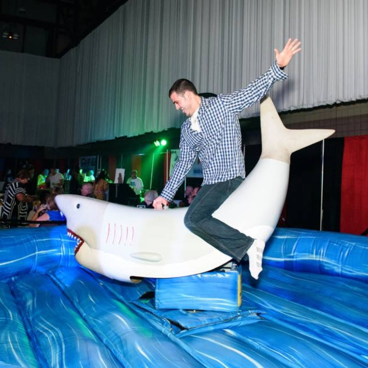 Man Riding Mechanical Shark Ride Rental at Event in Rochester, NY