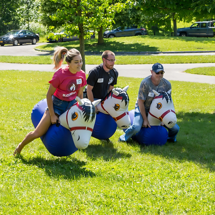 Three Players Riding Inflatable Pony Hop Rentals in Rochester, NY