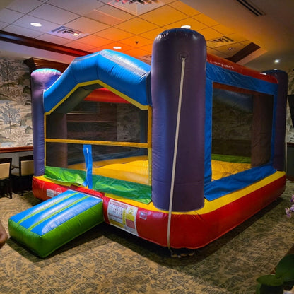A colorful inflatable bounce house set up indoors for an event in Penfield, NY. 