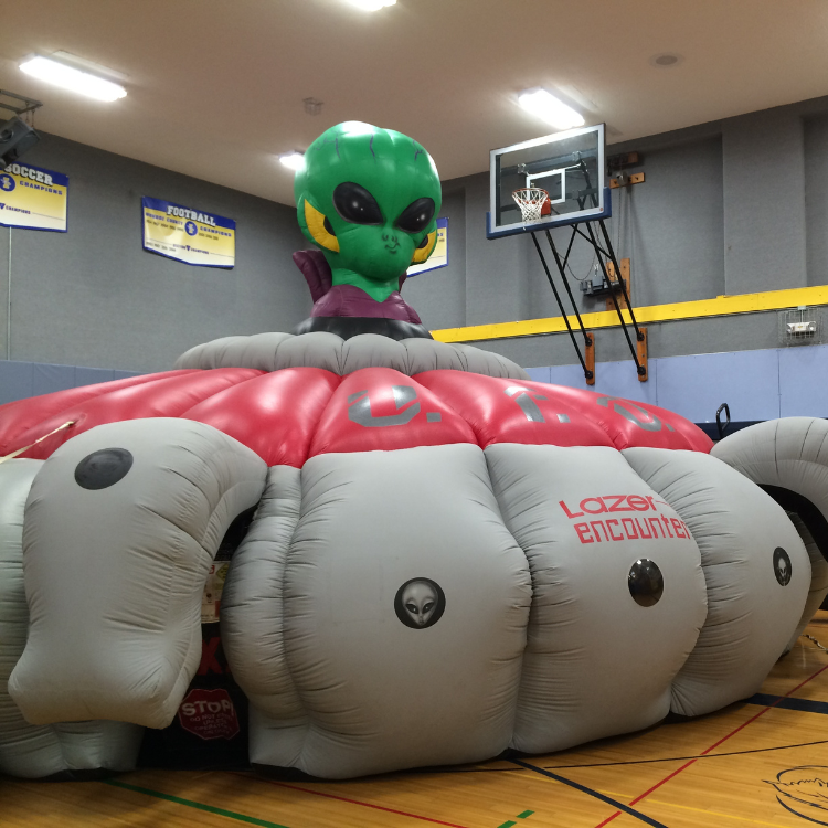 UFO Laser Tag Arena Inflatable Setup Inside of a School Gymnasium