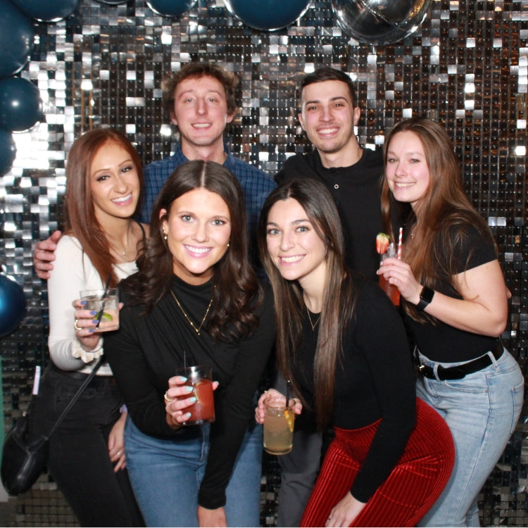 Group Enjoying Photo Booth Rental in Rochester, NY at Holiday Party