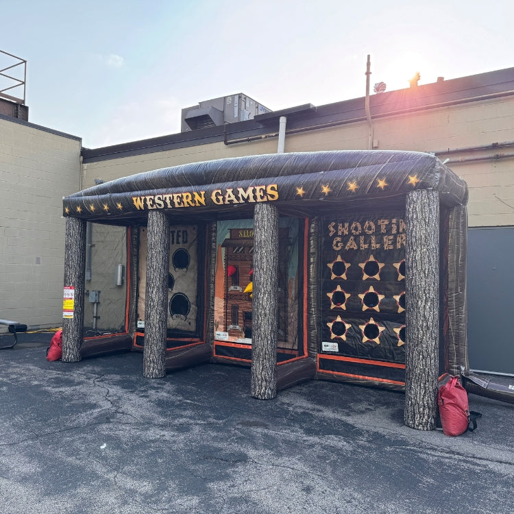 Inflatable western-themed carnival game booth setup prior to an event starting in Rochester, NY.
